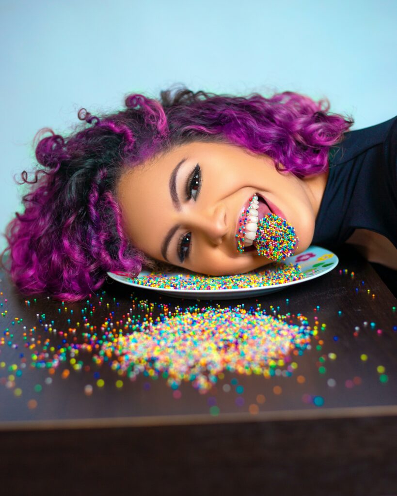 lady with tongue covered in sprinkles